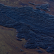 Oil floats in the water of the Talbert Marshlands as a 3,000-barrel oil spill, about 126,000 gallons, from an offshore oil rig reaches the shore and sensitive wildlife habitats in Newport Beach, California on October 3, 2021. -